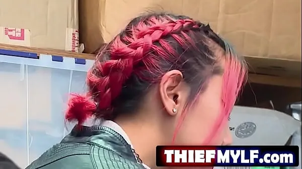 Svež Suspect is an adolesc3nt Asian female with red-dyed hair top Tube